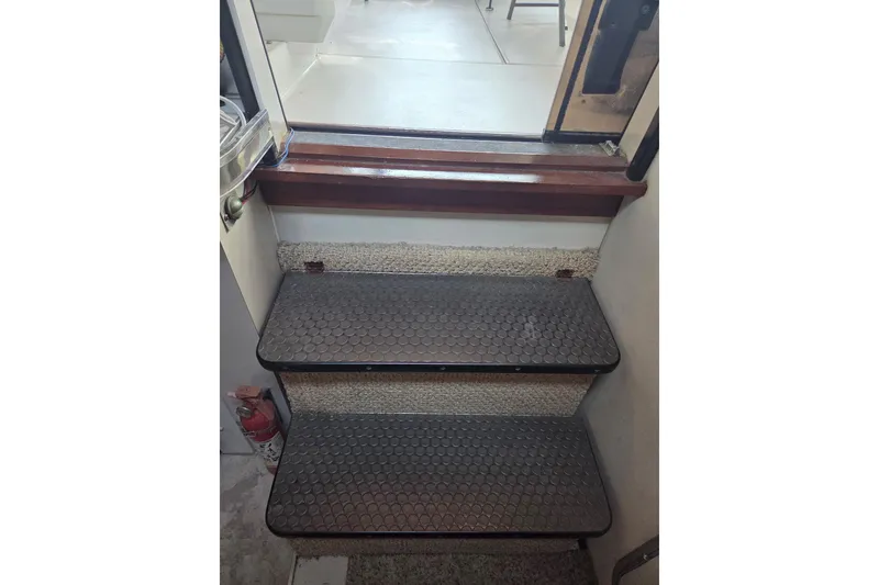 Slide: The Image of Interior steps of a 1988 Wellcraft 3200 St. Tropez boat with non-slip treads. - 6