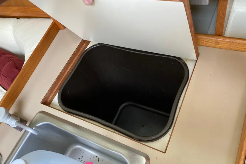 Slide: The Image of Interior of 1992 Hunter 33.5 sailboat showing sink and storage compartment. - 19