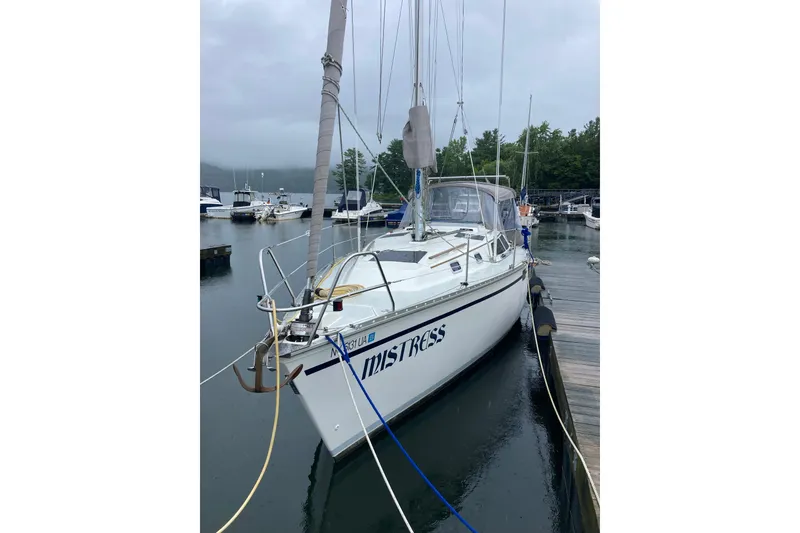 Slide: The Image of Sailboat docked at marina, 1992 Hunter 33.5 model, overcast sky. - 2