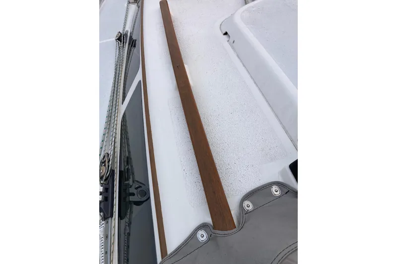 Slide: The Image of Wooden tiller on a 1992 Hunter 33.5 sailboat deck. - 3