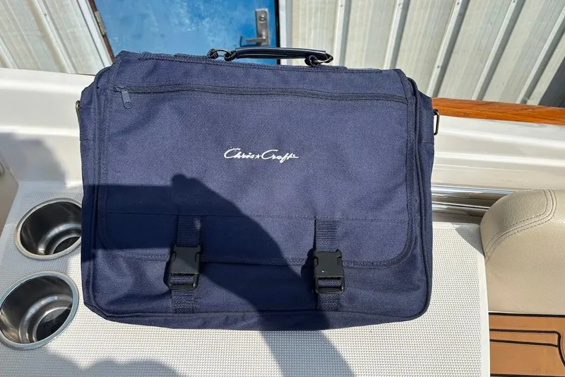 Slide: The Image of Navy blue Chris-Craft bag on 2007 Corsair 25 boat, near cup holders. - 20