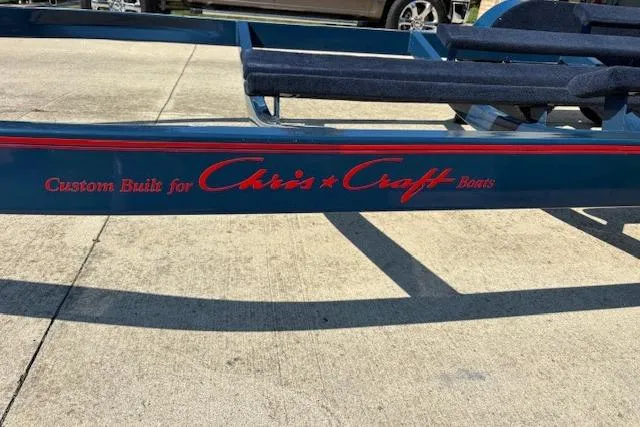 Slide: The Image of Trailer for 2007 Chris-Craft Corsair 25 boat, custom-built, on concrete surface. - 23