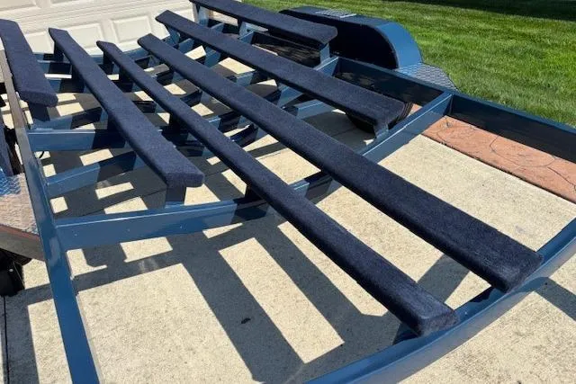 Slide: The Image of Trailer for 2007 Chris-Craft Corsair 25 boat, featuring blue carpeted supports. - 25