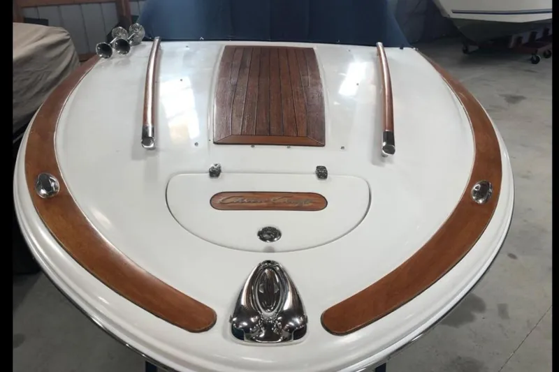 Slide: The Image of 2007 Chris-Craft Corsair 25 boat with elegant wood and chrome detailing. - 6