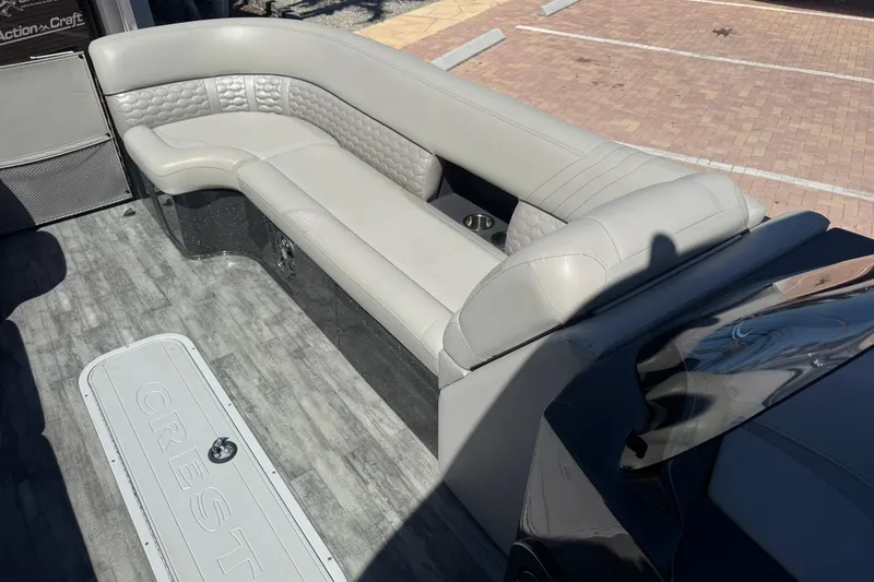 Slide: The Image of 2021 Crest Caribbean Platinum 250 SLC boat interior with luxurious seating and flooring. - 14