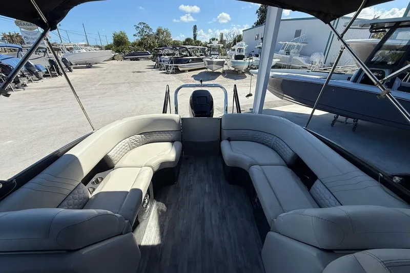Slide: The Image of 2021 Crest Caribbean Platinum 250 SLC pontoon boat with spacious seating and modern design. - 22