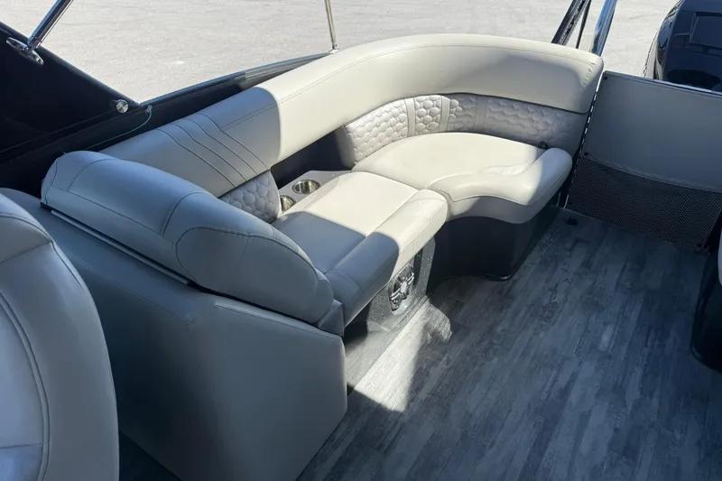 Slide: The Image of Luxurious seating on 2021 Crest Caribbean Platinum 250 SLC boat, featuring elegant upholstery and flooring. - 23