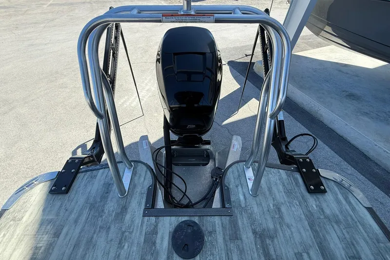 Slide: The Image of 2021 Crest Caribbean Platinum 250 SLC boat with outboard motor and stainless steel railing. - 25