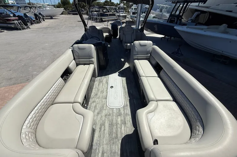 Slide: The Image of 2021 Crest Caribbean Platinum 250 SLC pontoon boat with luxurious seating and spacious interior. - 8
