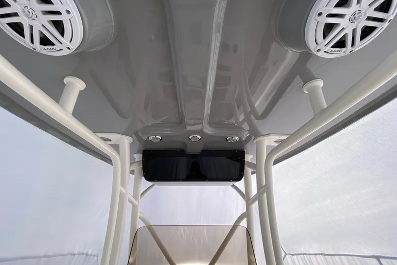 Slide: The Image of 2026 Pioneer 222 Islander boat interior with speakers and canopy structure. - 6