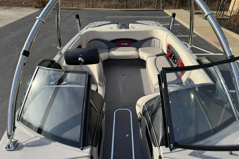 Slide: The Image of 2008 Malibu Sunscape 23 LSV boat interior with seating and open windshield. - 10