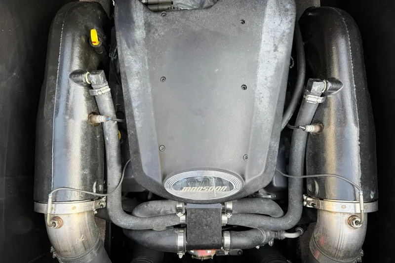 Slide: The Image of Engine of a 2008 Malibu Sunscape 23 LSV boat, featuring Monsoon branding. - 14