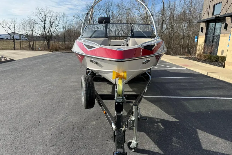 Slide: The Image of 2008 Malibu Sunscape 23 LSV boat on trailer in parking lot, front view. - 8