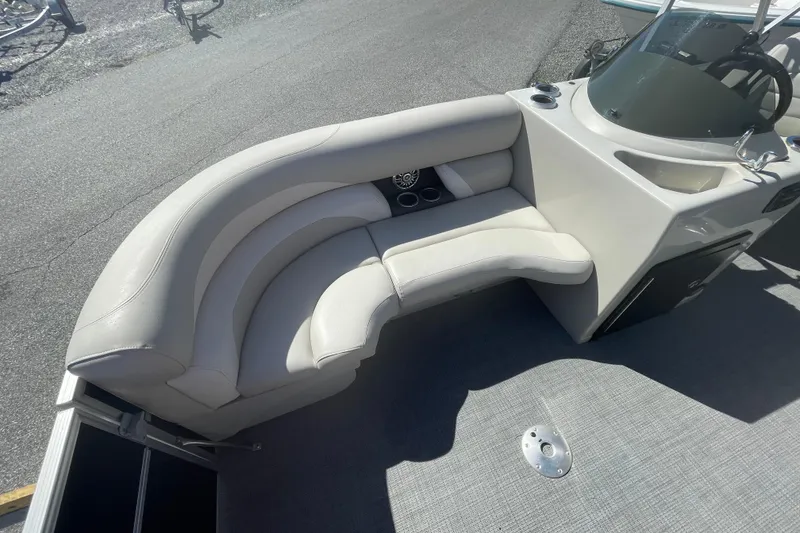 Slide: The Image of 2016 Starcraft EX 20 CF boat with curved seating and modern dashboard. - 15