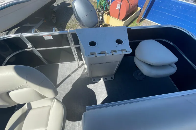 Slide: The Image of 2016 Starcraft EX 20 CF boat interior with seating and console. - 8