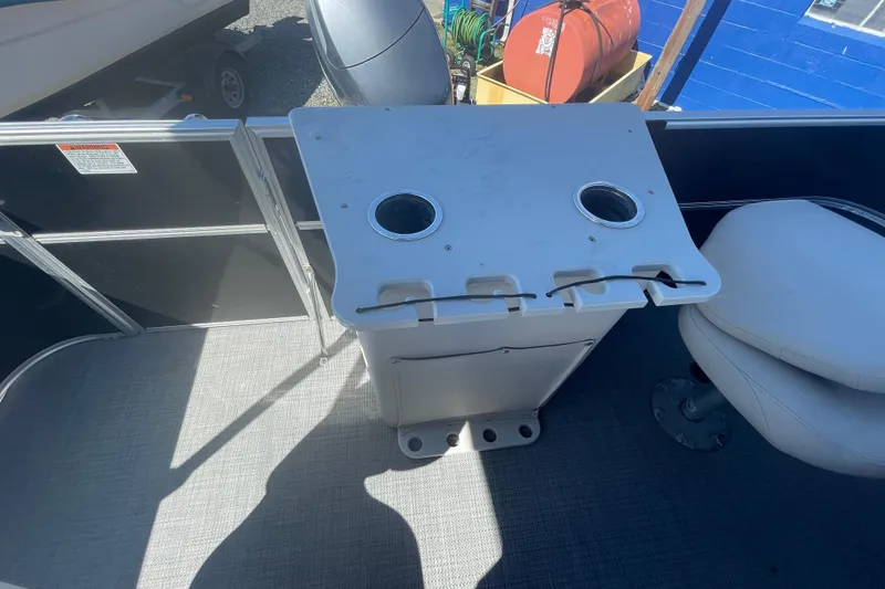 Slide: The Image of 2016 Starcraft EX 20 CF boat interior with table and seating. - 9