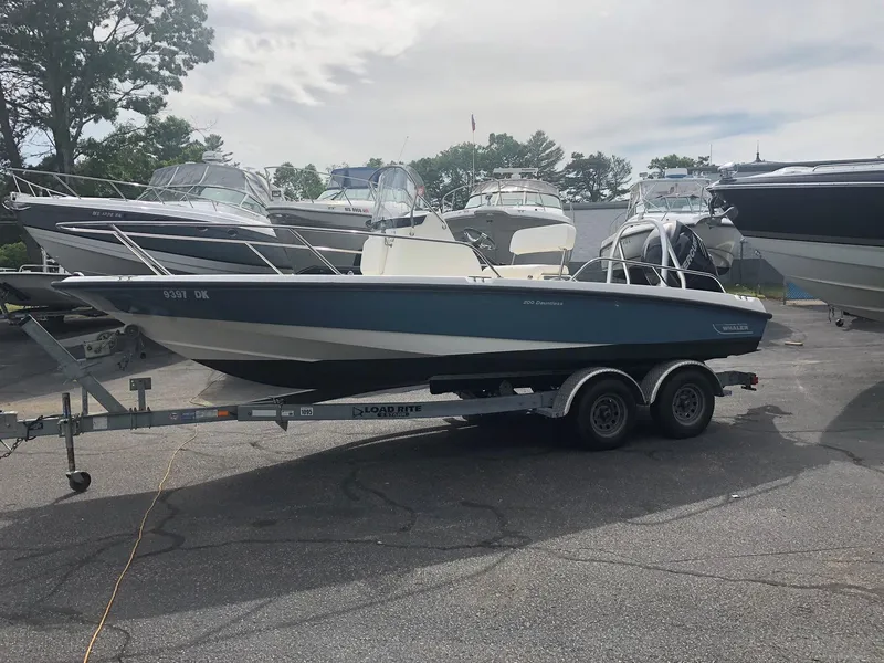 Slide: The Image of 2012 Boston Whaler 200 Dauntless on trailer outdoors. - 3