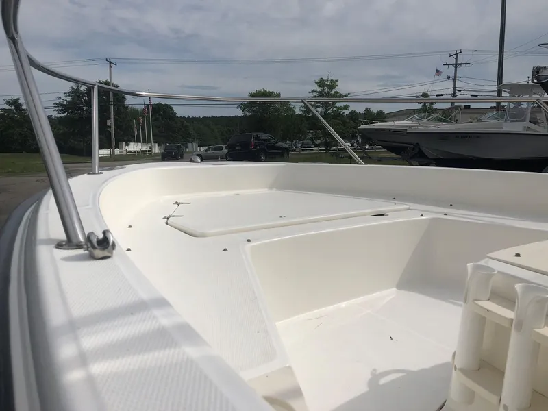 Slide: The Image of 2012 Boston Whaler 200 Dauntless boat, deck view outdoors. - 8