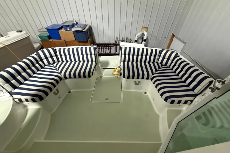 Slide: The Image of 2017 Back Cove 37 boat interior with striped seating in storage. - 11