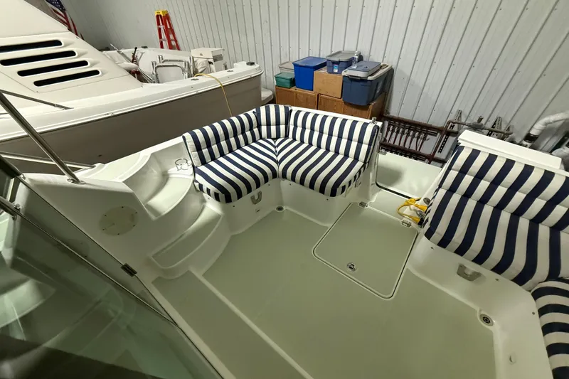 Slide: The Image of 2017 Back Cove 37 yacht interior with striped seating in a storage facility. - 12