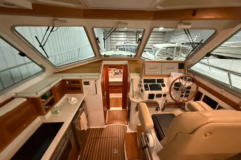 Slide: The Image of Interior of a 2017 Back Cove 37 boat with helm and navigation equipment. - 19