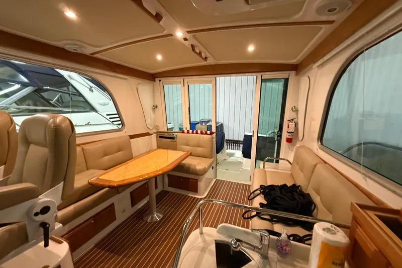 Slide: The Image of Luxurious interior of a 2017 Back Cove 37 yacht with elegant seating and wooden accents. - 20