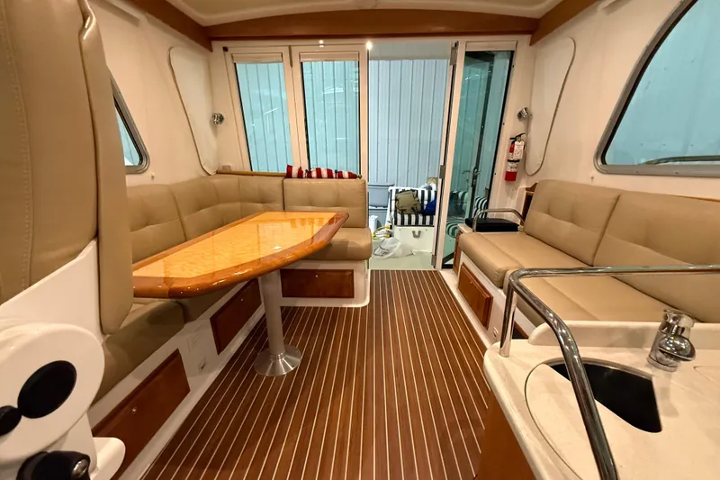 Slide: The Image of Luxurious interior of a 2017 Back Cove 37 yacht with elegant seating and wooden flooring. - 21