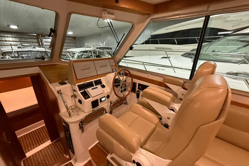 Slide: The Image of Interior of a 2017 Back Cove 37 yacht with leather seats and Garmin navigation. - 24