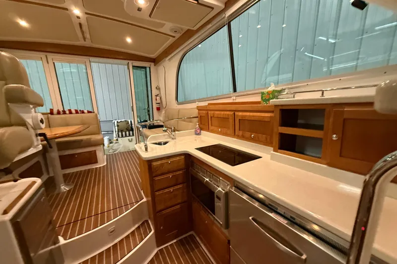 Slide: The Image of Luxurious interior of 2017 Back Cove 37 yacht with modern kitchen and seating area. - 30