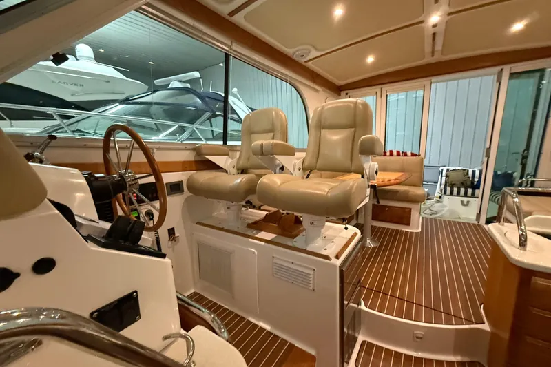 Slide: The Image of Interior of 2017 Back Cove 37 yacht with leather seats and wooden flooring. - 32