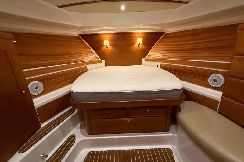 Slide: The Image of Luxurious cabin interior of 2017 Back Cove 37 yacht with wood paneling and cozy lighting. - 34