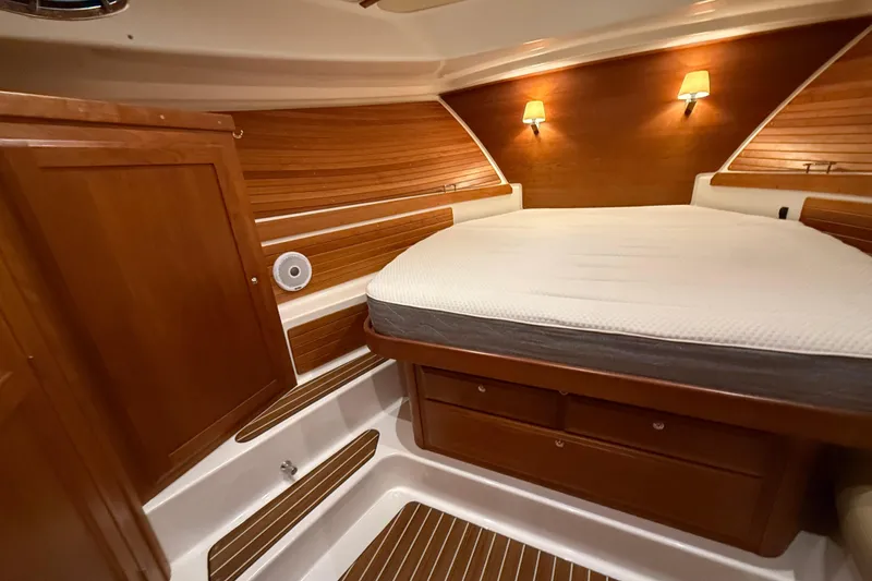 Slide: The Image of Luxurious cabin interior of 2017 Back Cove 37 yacht with wood paneling and cozy lighting. - 35