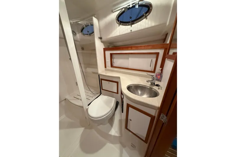 Slide: The Image of 2017 Back Cove 37 yacht bathroom with sink, toilet, and shower. - 44