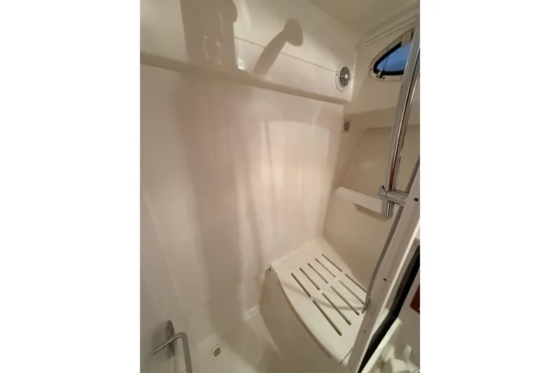 Slide: The Image of 2017 Back Cove 37 shower area with white interior and chrome fixtures. - 45