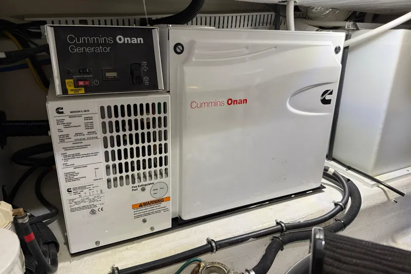 Slide: The Image of Cummins Onan generator in 2017 Back Cove 37 boat engine room. - 49