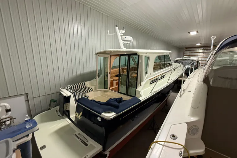 Slide: The Image of 2017 Back Cove 37 yacht in indoor storage, showcasing sleek design and spacious deck. - 8
