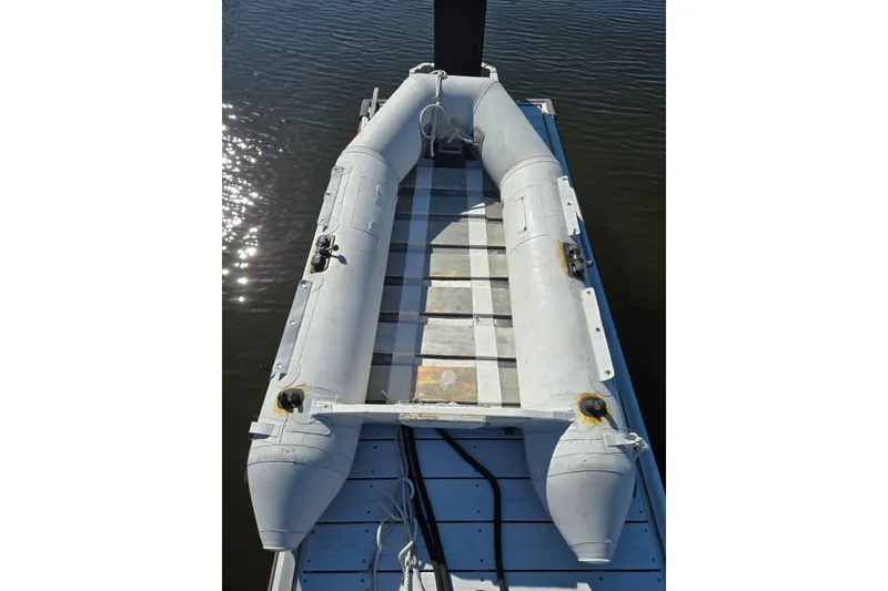 Slide: The Image of Inflatable boat docked on water, Hunter 326 model, 2003. - 4
