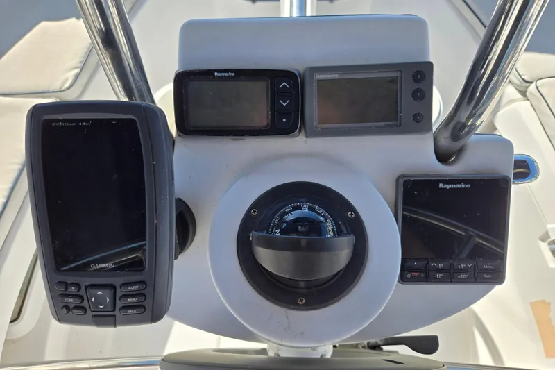 Slide: The Image of Control panel of a 2003 Hunter 326 sailboat with navigation instruments. - 8