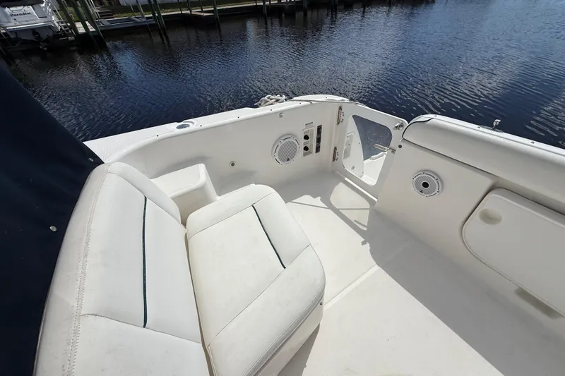 Slide: The Image of 2004 Tiara Yachts 3600 Sovran cockpit with white seating and water view. - 14