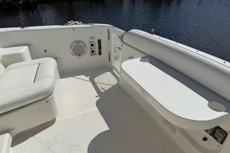 Slide: The Image of 2004 Tiara Yachts 3600 Sovran cockpit with seating and speaker, overlooking water. - 15