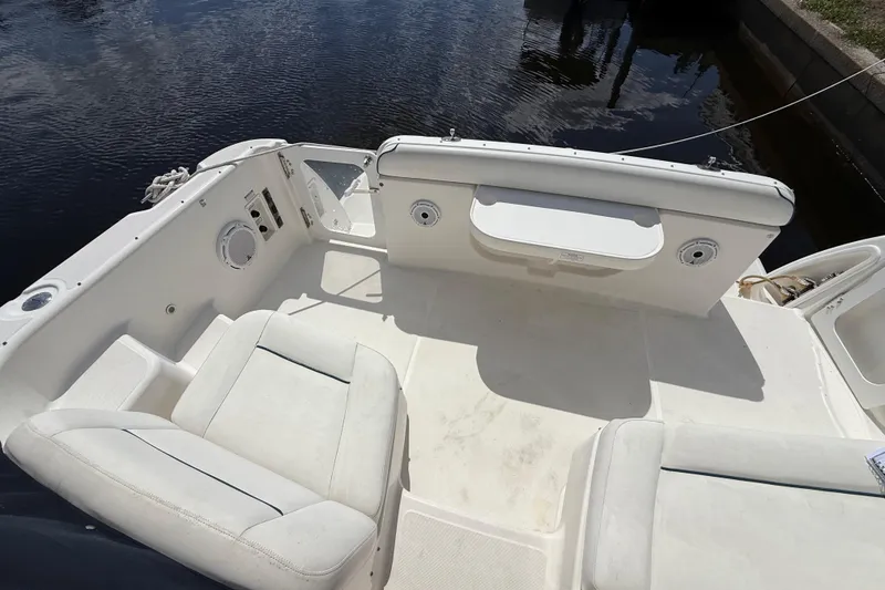 Slide: The Image of 2004 Tiara Yachts 3600 Sovran cockpit with white seating and water view. - 16