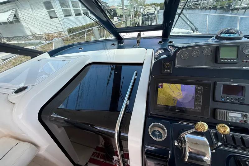 Slide: The Image of 2004 Tiara Yachts 3600 Sovran helm with navigation equipment and controls. - 18