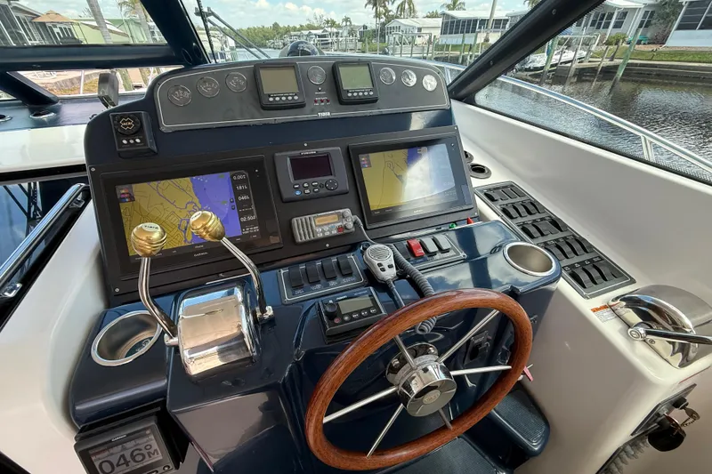 Slide: The Image of Helm of 2004 Tiara Yachts 3600 Sovran with navigation and control systems. - 21