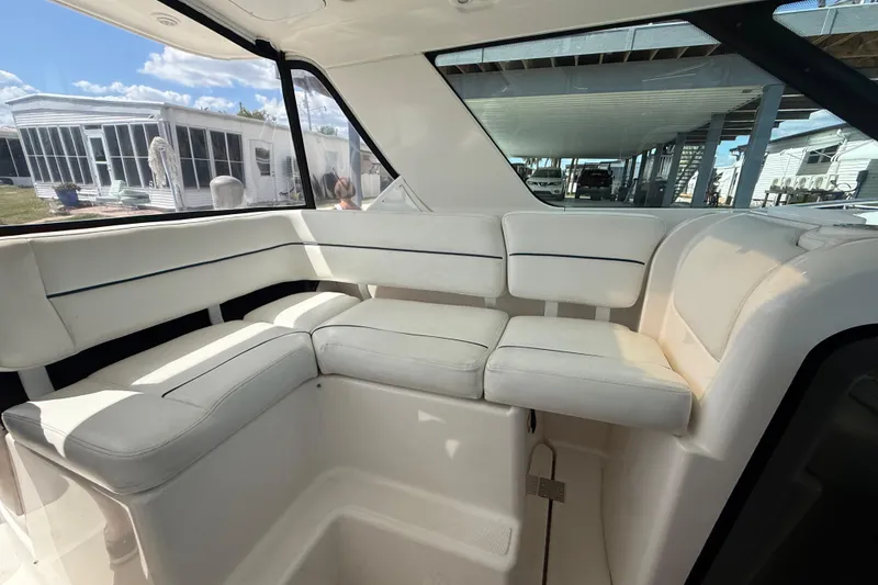 Slide: The Image of Interior seating of 2004 Tiara Yachts 3600 Sovran with white upholstery. - 26