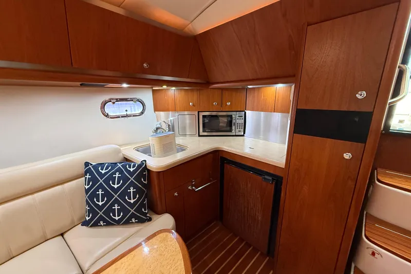 Slide: The Image of Luxurious 2004 Tiara Yachts 3600 Sovran interior with kitchenette and seating area. - 39
