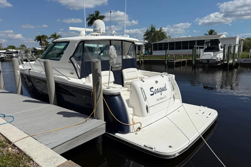 Slide: The Image of 2004 Tiara Yachts 3600 Sovran docked, sunny day, calm water, Fort Myers, FL. - 4