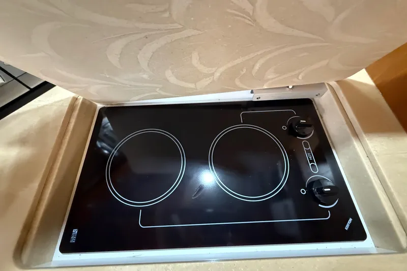 Slide: The Image of Electric stovetop in 2004 Tiara Yachts 3600 Sovran, featuring dual burners and sleek design. - 42