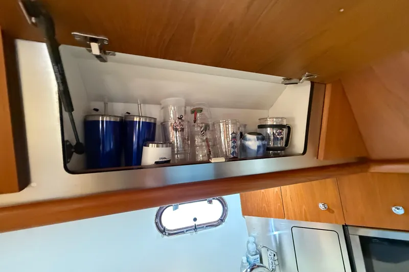 Slide: The Image of Cabinet in 2004 Tiara Yachts 3600 Sovran galley with cups and glasses. - 45