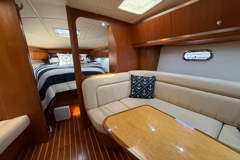 Slide: The Image of Luxurious interior of 2004 Tiara Yachts 3600 Sovran with cozy seating and elegant wood finishes. - 46