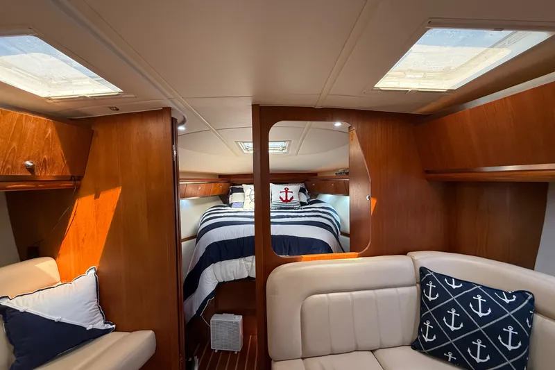 Slide: The Image of Luxurious 2004 Tiara Yachts 3600 Sovran interior with cozy cabin and nautical decor. - 49